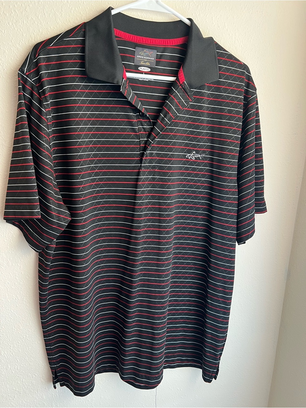 Greg Norman Collection Black Polo with Red Stripe Accents